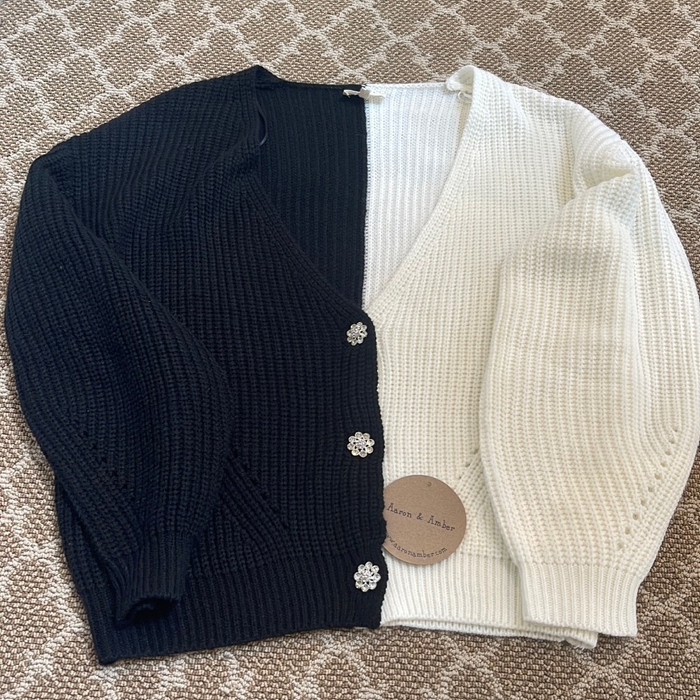 Brand New!! Beautiful color block sweater with button embellishments. Size S.